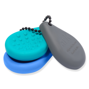 Compacte sleutelhanger fidget met verschillende texturen voor sensorische ondersteuning bij autisme, ADHD en prikkelverwerking. Discreet en praktisch.