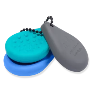Compacte sleutelhanger fidget met verschillende texturen voor sensorische ondersteuning bij autisme, ADHD en prikkelverwerking. Discreet en praktisch.